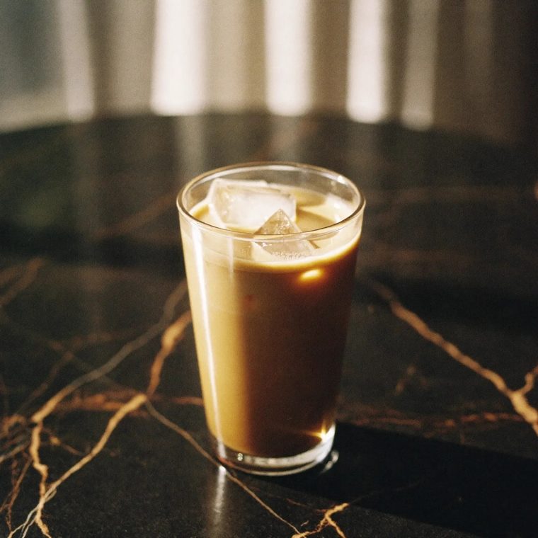 An iced latte in a clear glass